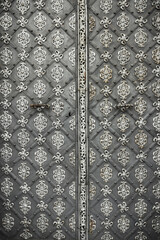 Ornate steel door with intricate metalwork designs