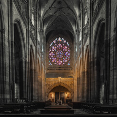 Gothic cathedral interior with stained glass window