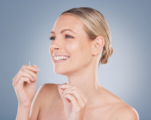 Dental, floss and woman with clean teeth in studio background and thinking of healthy gums. Person,...
