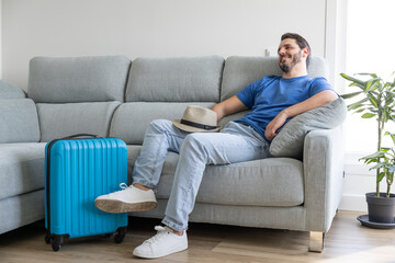 man with his hat on waiting for it to be time to go on vacation
