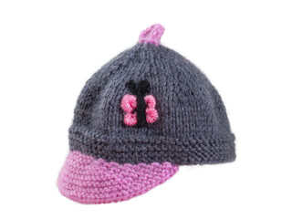 knitted hat made of wool yarn with a gray pompom, isolated on a white background