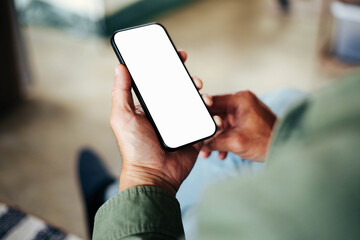 cell phone blank white screen mockup.hand holding texting using mobile on desk at office.background...