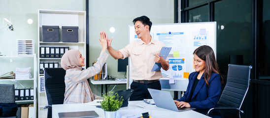 During a dynamic presentation, diverse professionals engage in teamwork, celebrating success with high fives, while discussing financial strategies illustrated on a whiteboard.