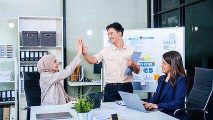 During a dynamic presentation, diverse professionals engage in teamwork, celebrating success with...