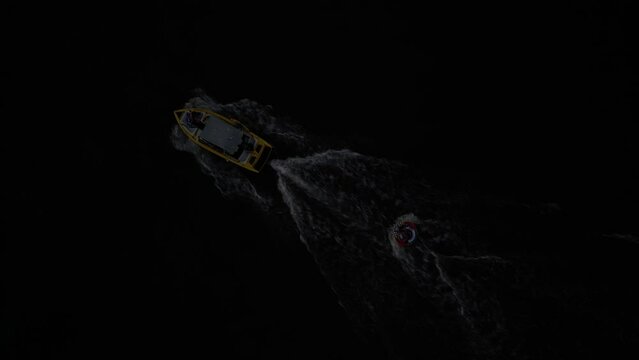 Aerial footage of boat towing an inflatable swim ring in Tequesquitengo lake in Morelos, Mexico
