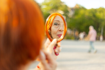 A middle-aged woman doing professional makeup.