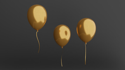 three golden balloons floating in the air