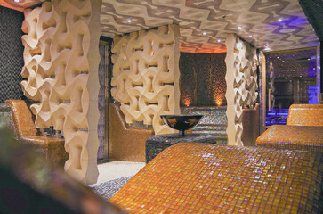 Finnish or dry sauna with oceanview or view of the sea inside male locker room of spa or wellness...