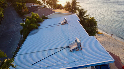 Water heaters on the roof of the building. Top view of the roof of the sea building with installed...