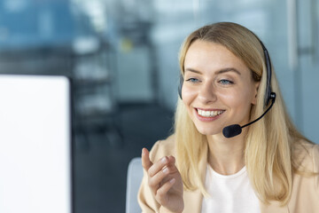 Smiling woman with headset talking during online meeting or customer support session