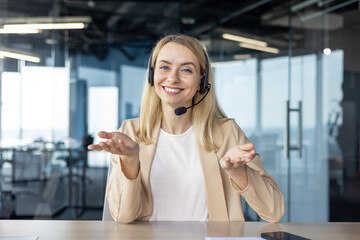 Smiling customer service representative with headset in a modern office