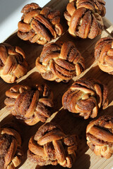 Cinnamon Buns. Fresh Buttery Cinnamon Buns on Wooden Board. Bakery Pastry.