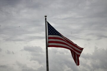 american flag against sky