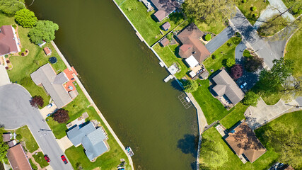 Fototapeta premium Aerial View of Suburban Neighborhood by Serene Lake, Warsaw, Indiana