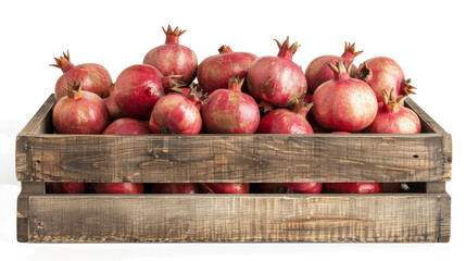 Fresh red pomegranates in a wooden basket on clean white background