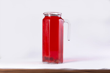 Fruit drink in a decanter. On a light background.
