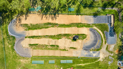 Aerial View of BMX Track with Benches and Structure in Sunny Park