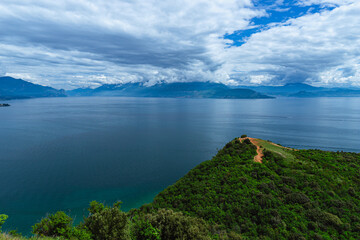 The view of Lake Garda from the Rocca di Manerba, during a spring day, near the town of Manerba,...