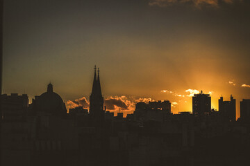 Naklejka premium City skyline at sunset, são paulo city with buildings and church 