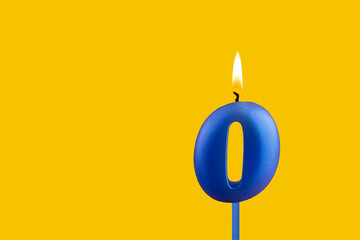 Blue birthday candle on yellow background - Number 0
