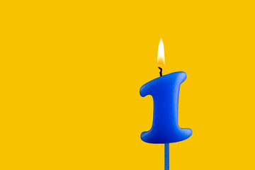 Blue candle number 1 - Birthday on yellow background