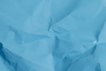 a piece of crumpled blue paper