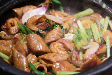 Sizzling Pork Intestines in casserole. Chinese Cantonese food