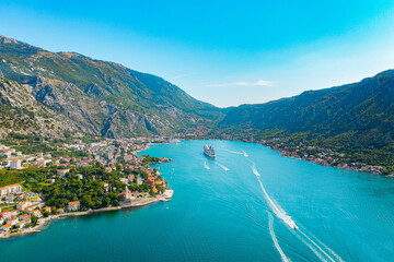 Spectacular View of Kotor Bay: Mountains, Cruise Ship, and Azure Waters