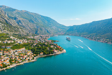 Spectacular View of Kotor Bay: Mountains, Cruise Ship, and Azure Waters