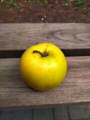 green apple on wooden table