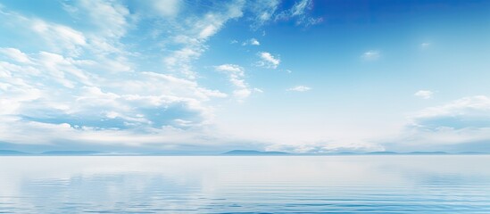 The sky merges with the calm sea providing a serene and tranquil copy space image