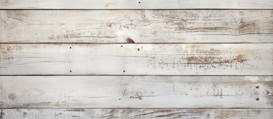 Obraz premium The weathered white wooden planks serve as a background with a worn surface texture making it an ideal graphic design element with available copy space image