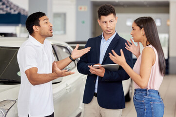 Couple, car dealership and stress with argument in discussion for and motor vehicle, finance and problem. Angry, man and woman with communication in showroom for automobile, purchase and conflict