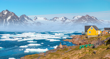 Panoramic view of colorful Kulusuk village in East Greenland - Kulusuk, Greenland - Melting of a...