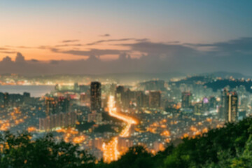 The lights of the night city. Blurred background. Lanterns on the street. big city lights in the twilight evening with blurring. Colorful circles of light abstract. circular bokeh on blue horizon.