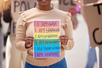 Protest, lgbtq and woman with poster, support and walking in street, paper or activism for human...