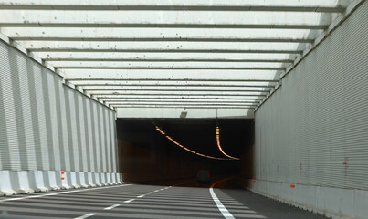 Highway tunnel with minimal traffic and noise barrier