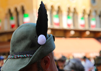 Black feather on the hat and Italian flag are the main Symbols of alpine Corps military called...