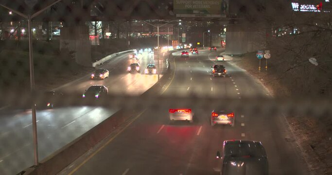 Slow Motion City highway from overpass NYC Queens Slow Pan Tilt