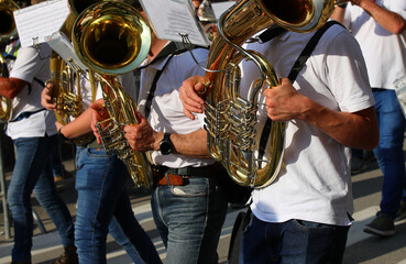 french horn players in a marching band performing