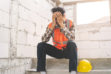 Engineer industry unemployed. Feeling stress, tired and headache asian man sitting depressed on...