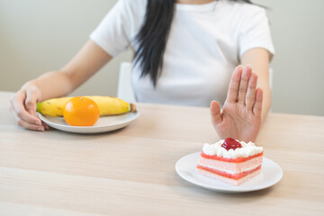 Diet asian young woman, girl hand push out, refuse eat piece strawberry cake, sweet or dessert...