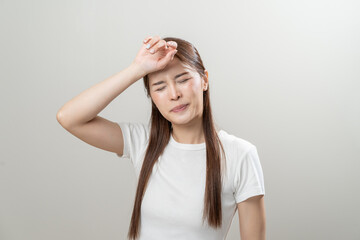Fototapeta premium Sweaty young woman feeling discomfort and hot isolated on background