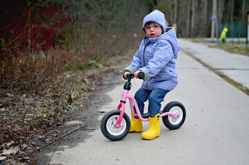 Toddler girl on balance bike