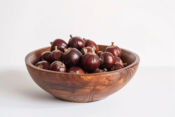 Obraz premium Horse chestnuts in bowl on white background