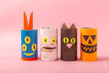 Toilet paper crafts on a colored background. Kids crafts made with toilet paper roll. DIY. Handmade. Paper toys. Origami animals. Concept of children's educational games. Place for text. Copy space.