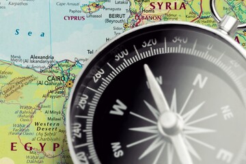 Magnetic retro compass on old map for travel