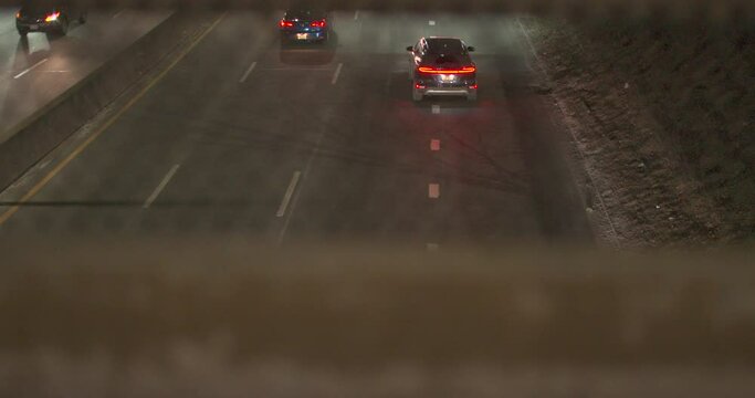 Cars driving on highway through Queens, NY. Slow motion V-Log Raw.