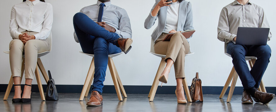 Recruiting, legs and business people in waiting room for hiring process, career opportunity and interview notes. Queue, tech and shoes of employees in lobby for onboarding with networking and laptop