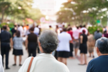 blurred for background. Crowd of people on the street. people walking on the city street. A blurry people walking. Urban, social concept. Abstract urban background with blurred buildings and street.